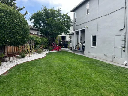 a view of a backyard with a patio