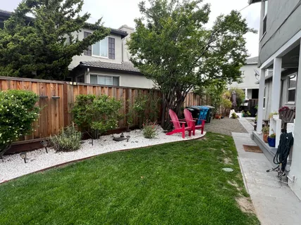 a front view of a house with swing and a slide