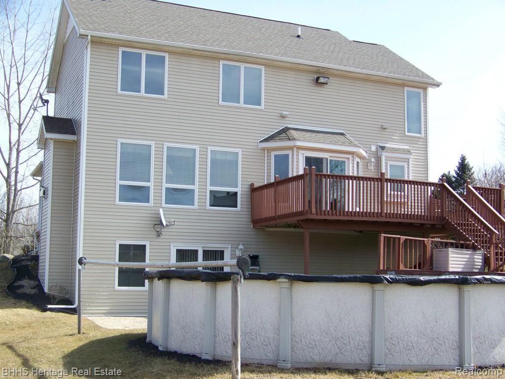 6599 Robb Road Fowlerville, MI 48836 - Photo 26 of 39 Pool and tiered decks