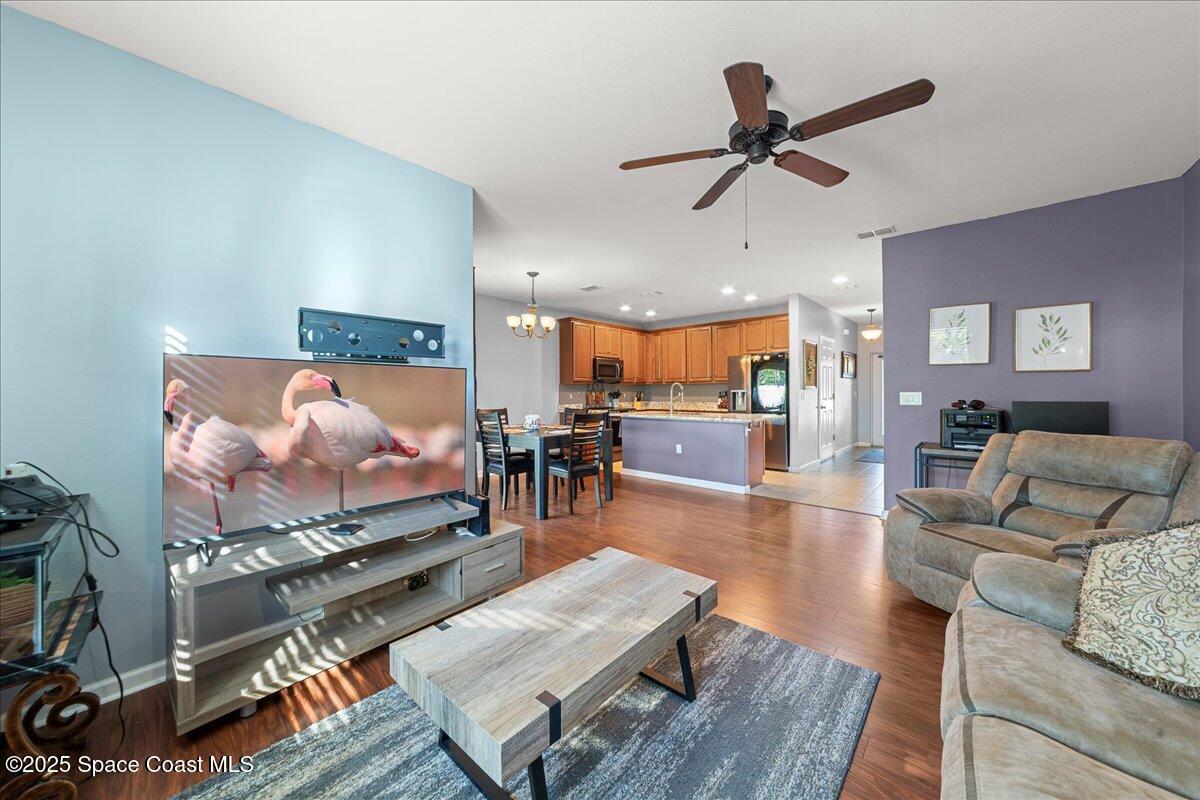 1345 Lara Circle, Unit 102 Rockledge, FL 32955 - Photo 16 of 34 a living room with furniture and a flat screen tv