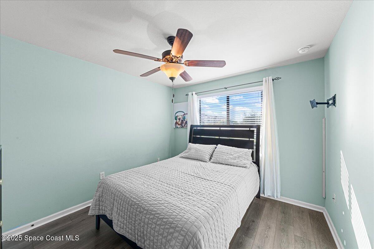 1345 Lara Circle, Unit 102 Rockledge, FL 32955 - Photo 23 of 34 a bedroom with a bed and a window