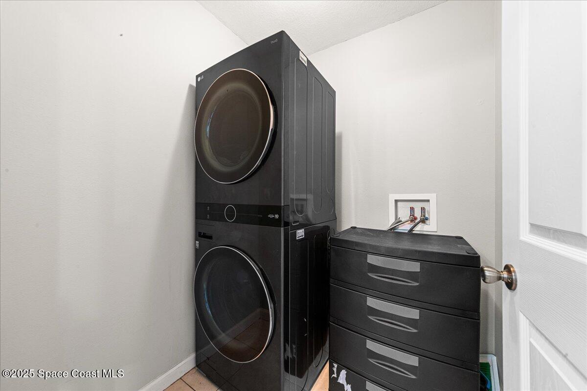 1345 Lara Circle, Unit 102 Rockledge, FL 32955 - Photo 26 of 34 a utility room with dryer and washer