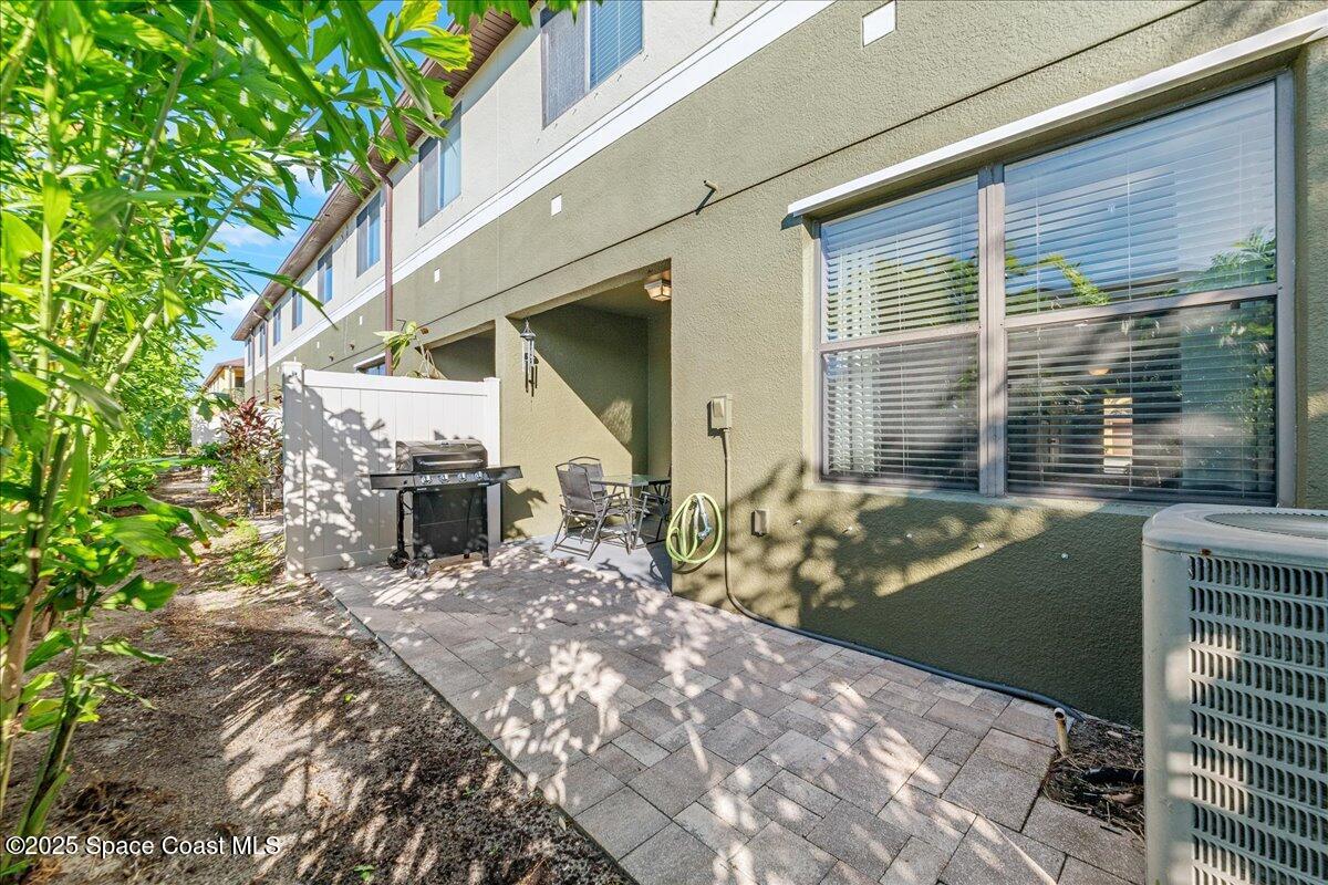1345 Lara Circle, Unit 102 Rockledge, FL 32955 - Photo 27 of 34 a view of a outdoor space with a patio and backyard