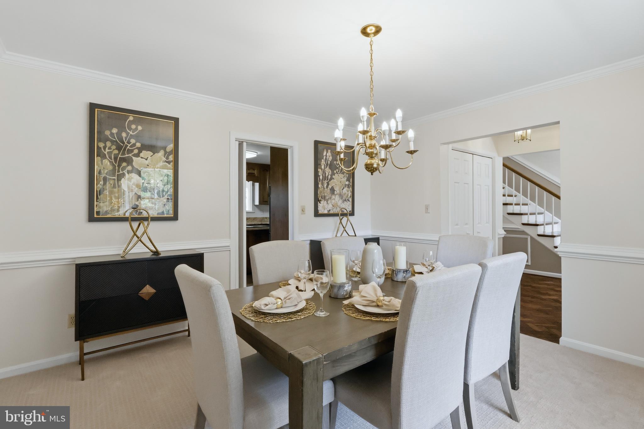 23500 River Road Lexington Park, MD 20653 - Photo 37 of 92 a view of a dining room with furniture a chandelier and wooden floor