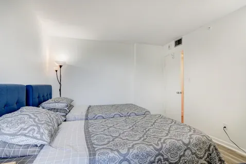 a bedroom with a bed and a closet