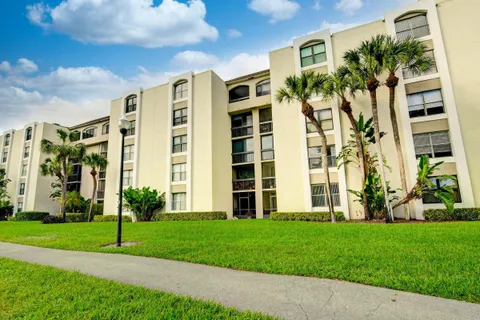 a view of a building with a yard