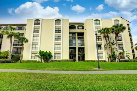a view of a building with a yard