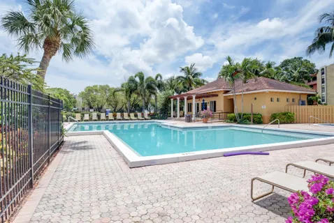 a view of swimming pool from a balcony