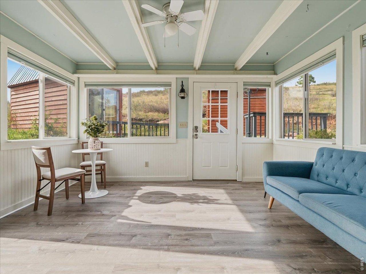 1652 Eiger Road Livermore, CO 80536 - Photo 5 of 50 Entry Sunroom. Cozy up with a book and a view.