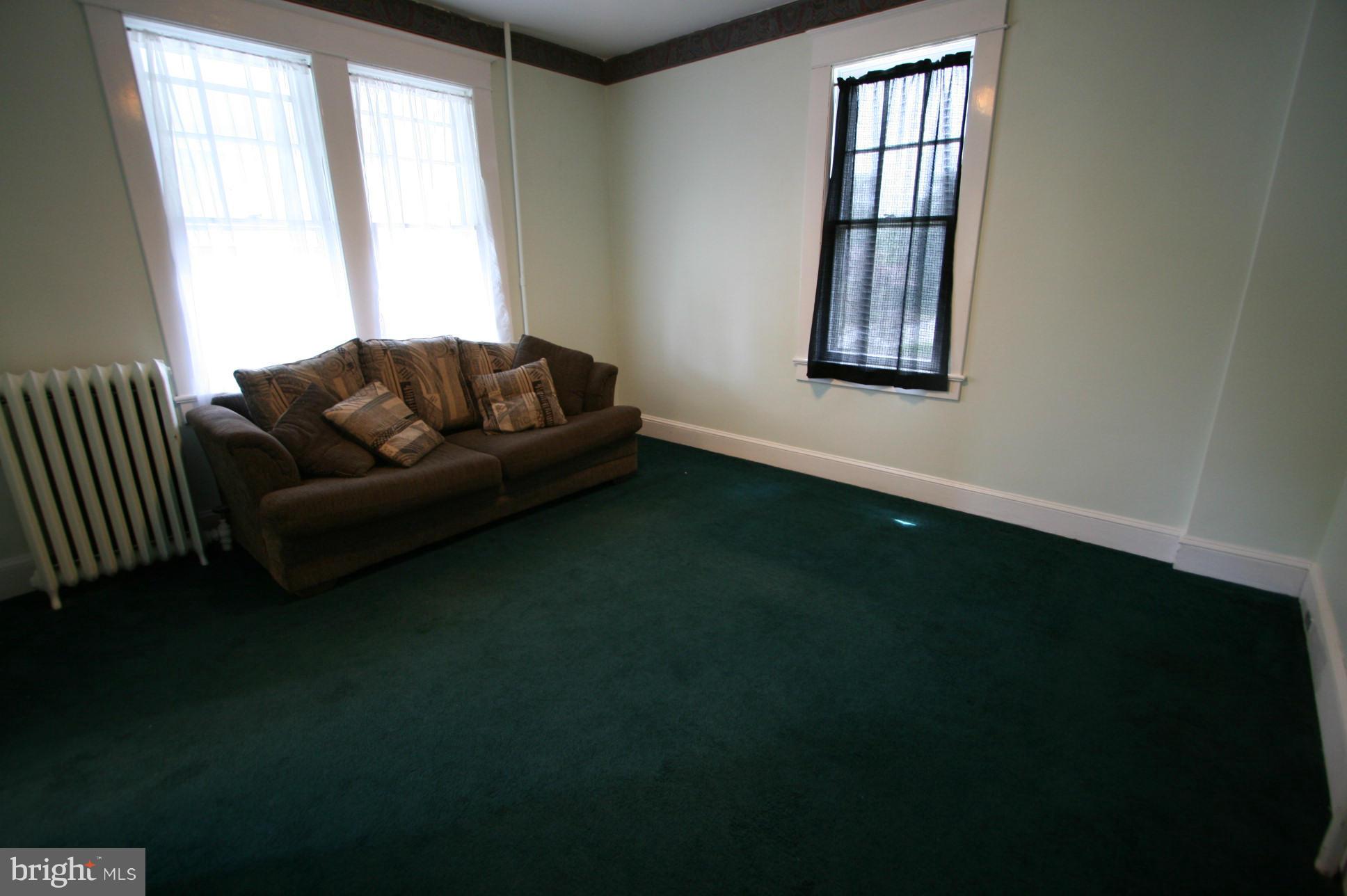 500 Cleveland Road Linthicum Heights, MD 21090 - Photo 2 of 26 a living room with furniture and a window