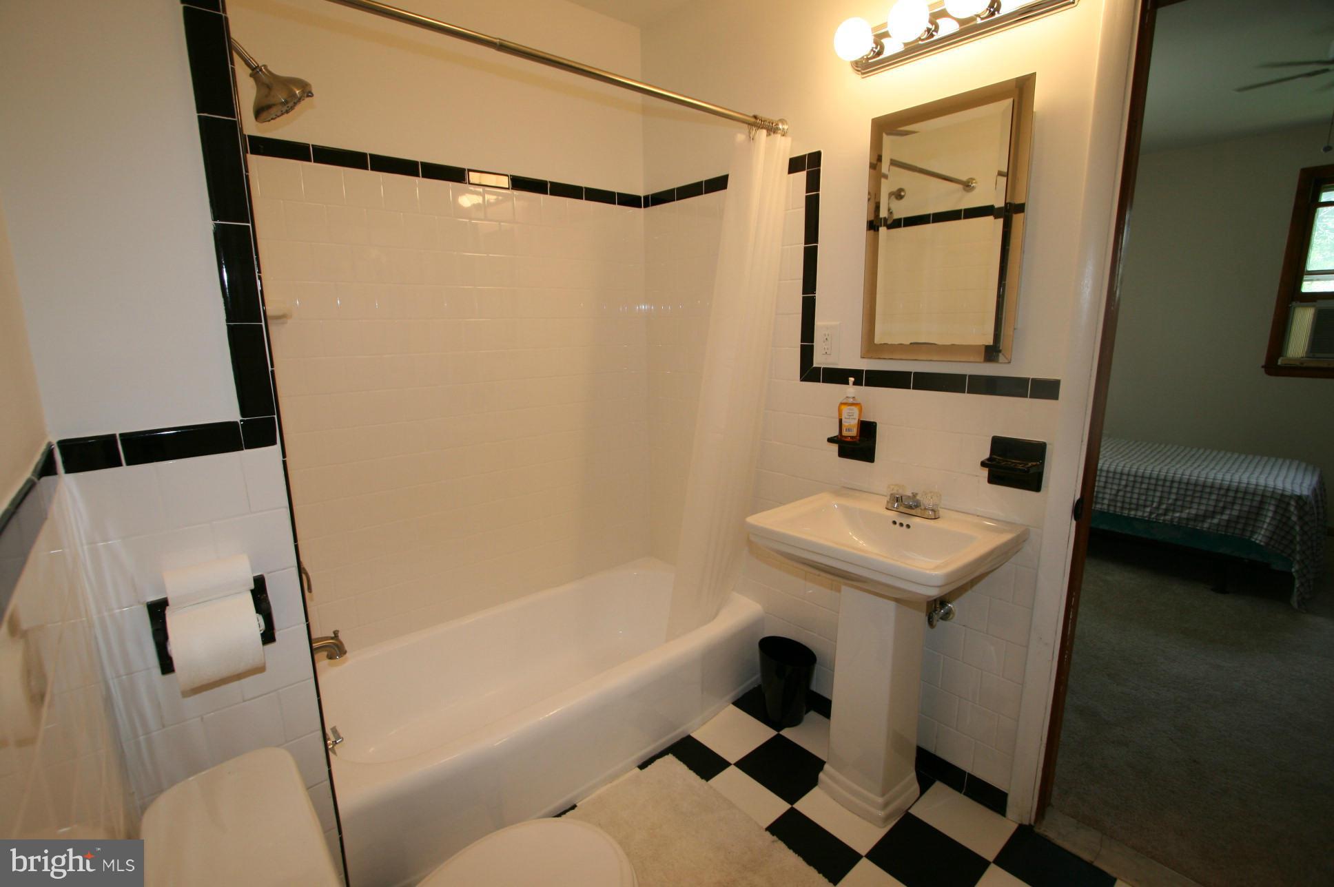 500 Cleveland Road Linthicum Heights, MD 21090 - Photo 12 of 26 a bathroom with a sink toilet and shower
