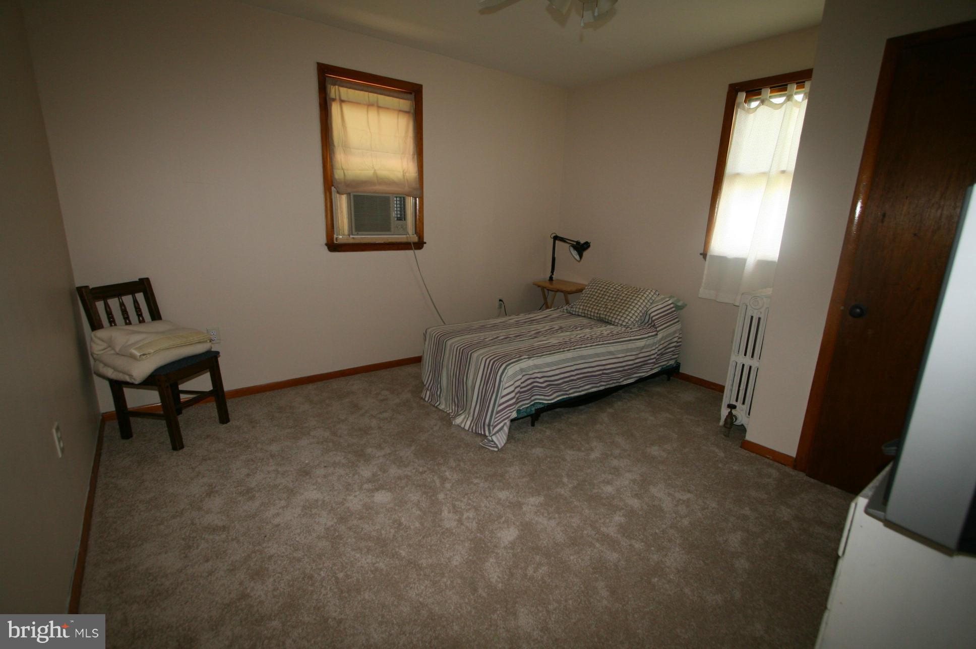 500 Cleveland Road Linthicum Heights, MD 21090 - Photo 13 of 26 a bed room with a bed and a chair