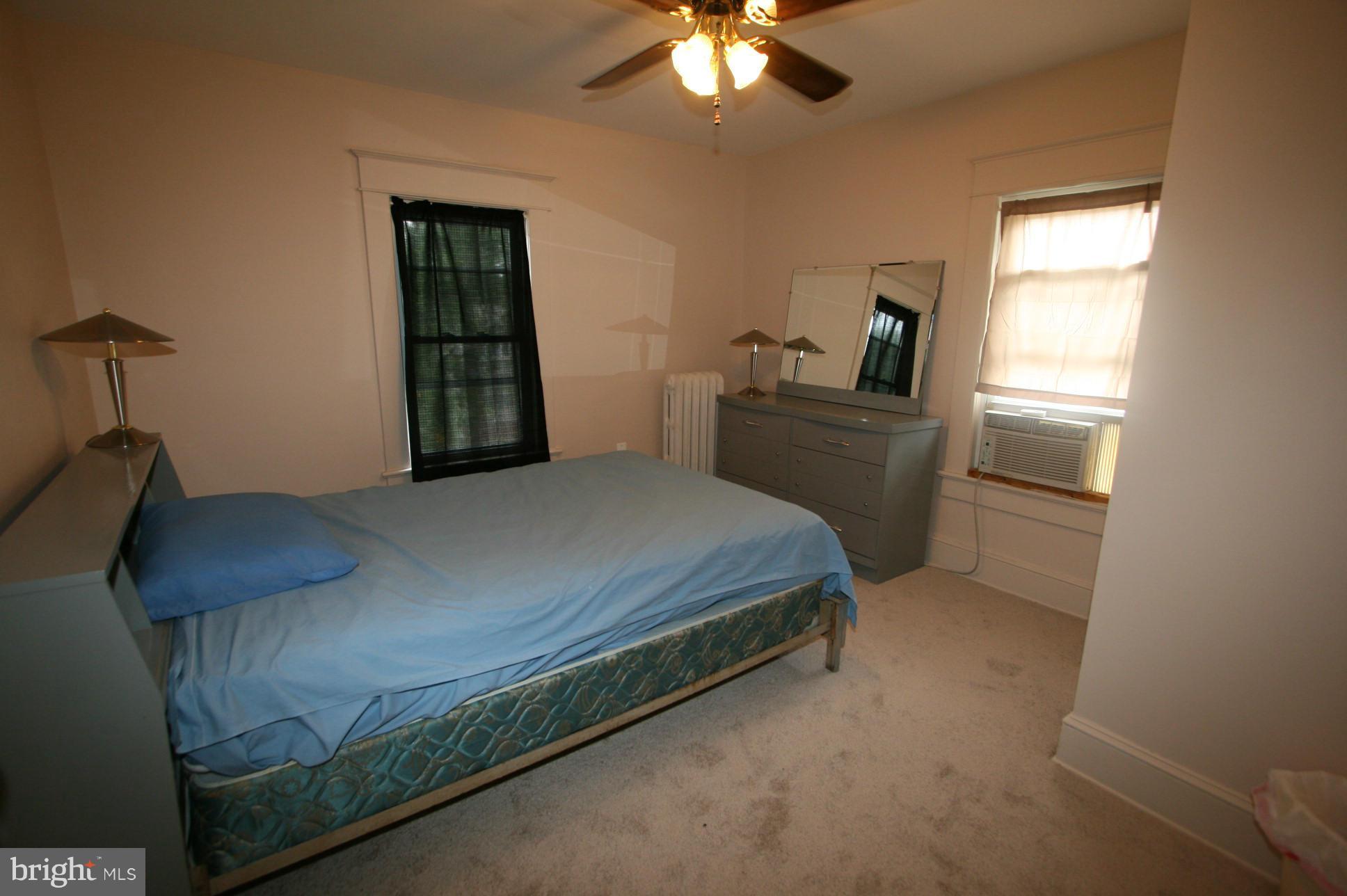 500 Cleveland Road Linthicum Heights, MD 21090 - Photo 16 of 26 a bedroom with a bed and a chandelier