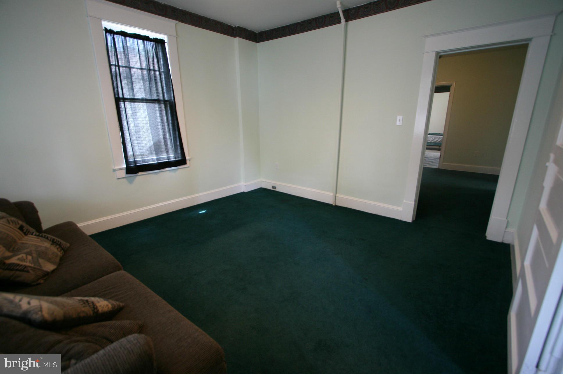 500 Cleveland Road Linthicum Heights, MD 21090 - Photo 3 of 26 a living room with furniture and a window