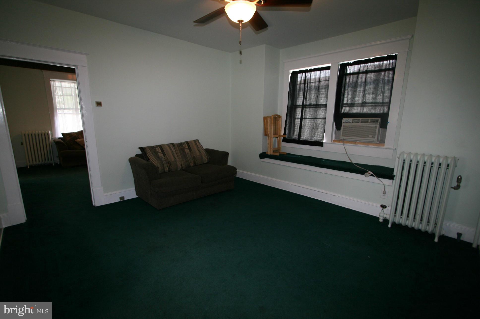 500 Cleveland Road Linthicum Heights, MD 21090 - Photo 5 of 26 a living room with furniture and a window