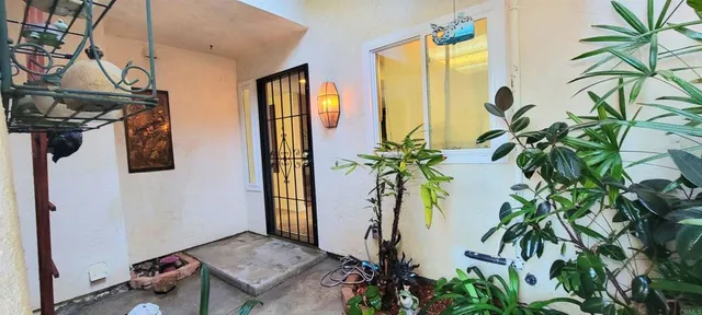 a view of a potted plants with sky from bathroom