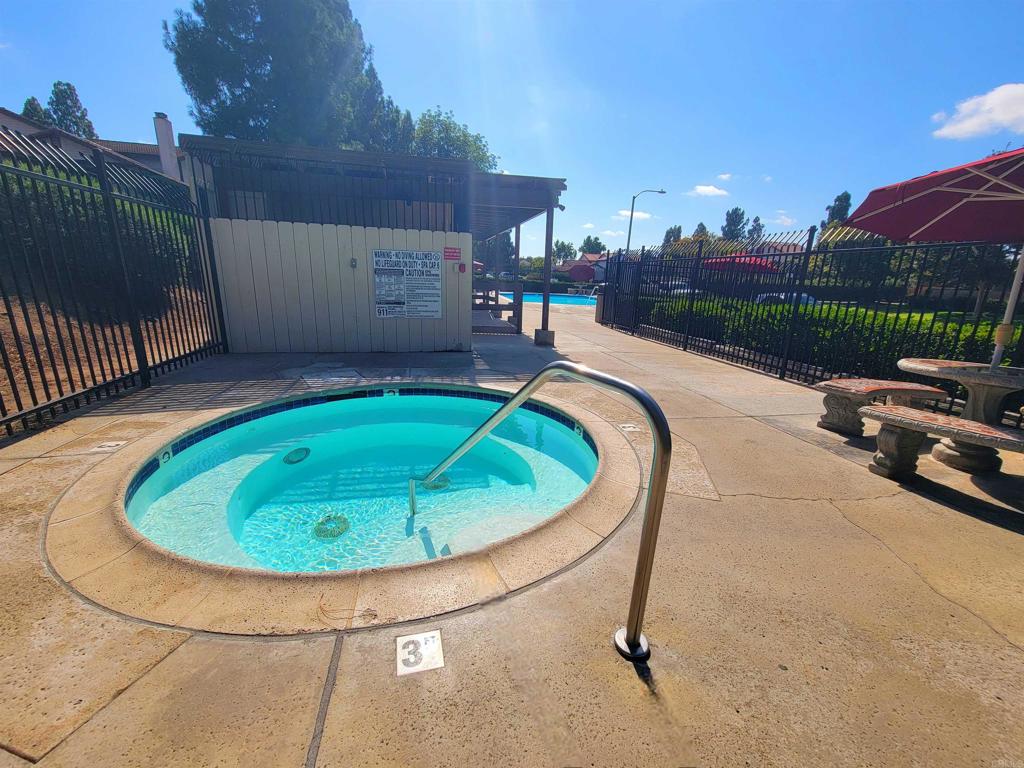 1469 Sundance Way Oceanside, CA 92057 - Photo 24 of 27 a view of a swimming pool with a patio and a yard