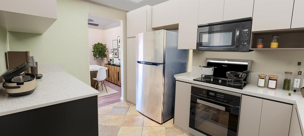 1469 Sundance Way Oceanside, CA 92057 - Photo 6 of 27 a kitchen with a stove and a refrigerator