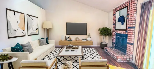 a living room with furniture and a flat screen tv
