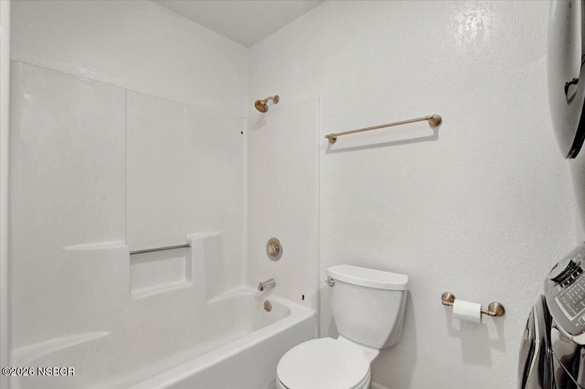3400 Santa Maria Way, Unit 207B Santa Maria, CA 93455 - Photo 33 of 50 a white toilet sitting next to a bath tub
