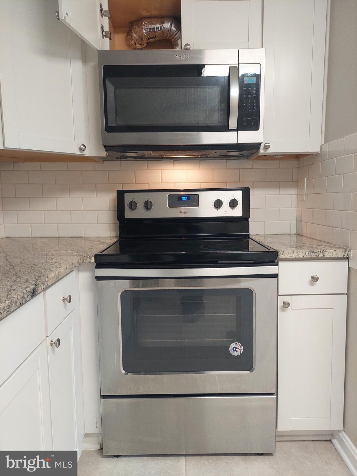 10149 Shelldrake Circle Damascus, MD 20872 - Photo 14 of 73 a stove top oven sitting inside of a kitchen