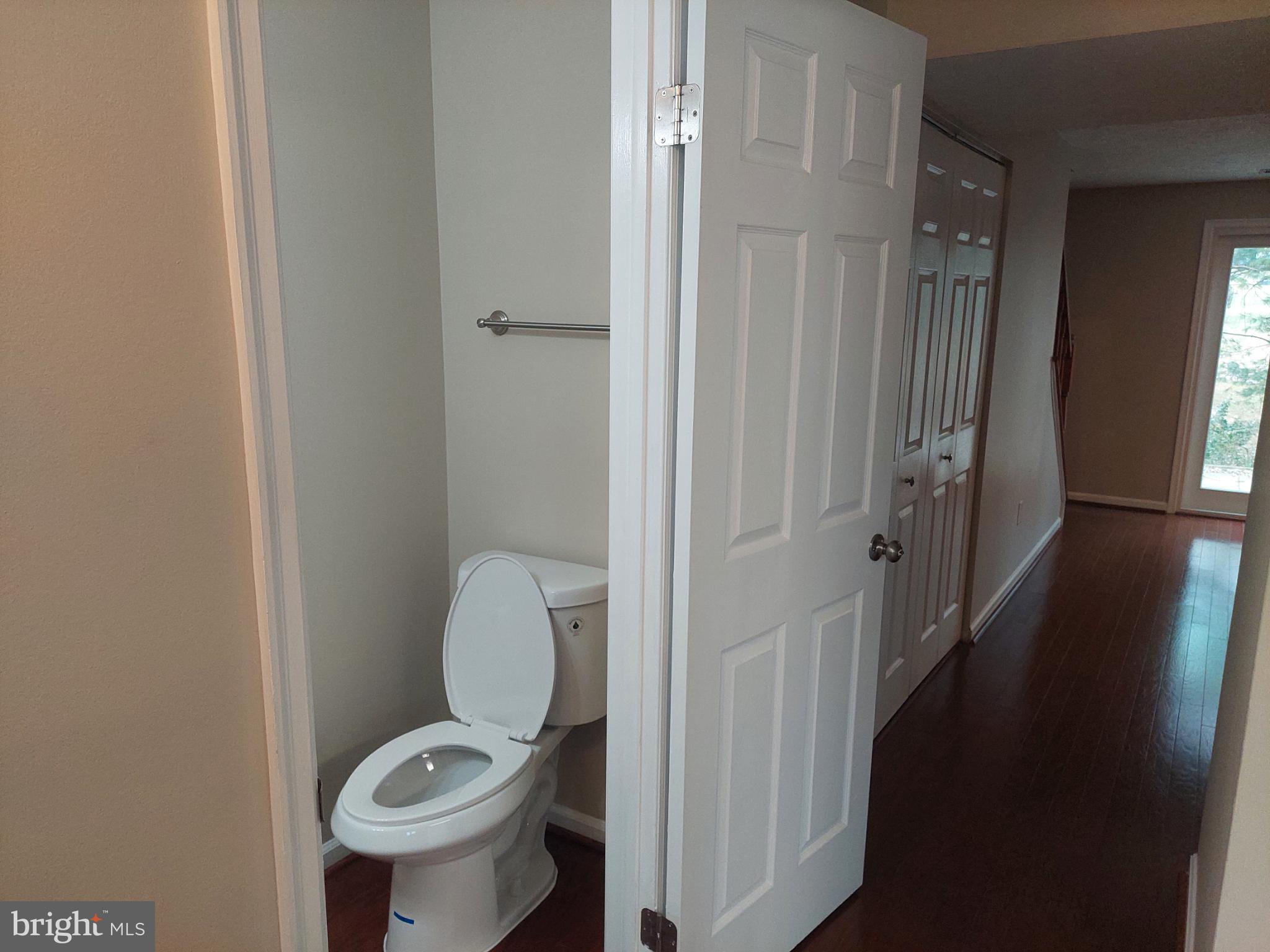 10149 Shelldrake Circle Damascus, MD 20872 - Photo 20 of 73 a bathroom with a granite countertop toilet and a sink