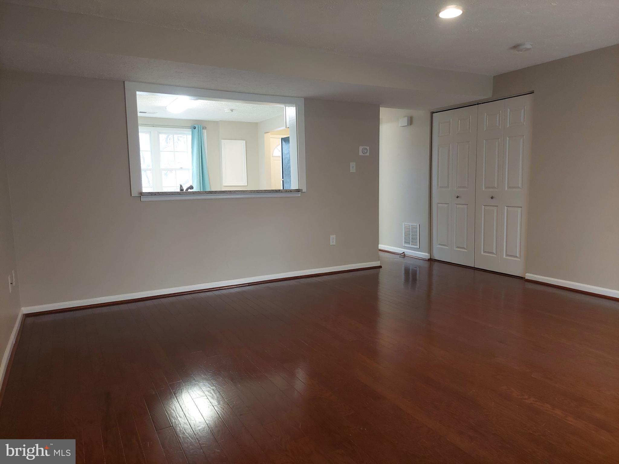 10149 Shelldrake Circle Damascus, MD 20872 - Photo 25 of 73 an empty room with wooden floor and windows