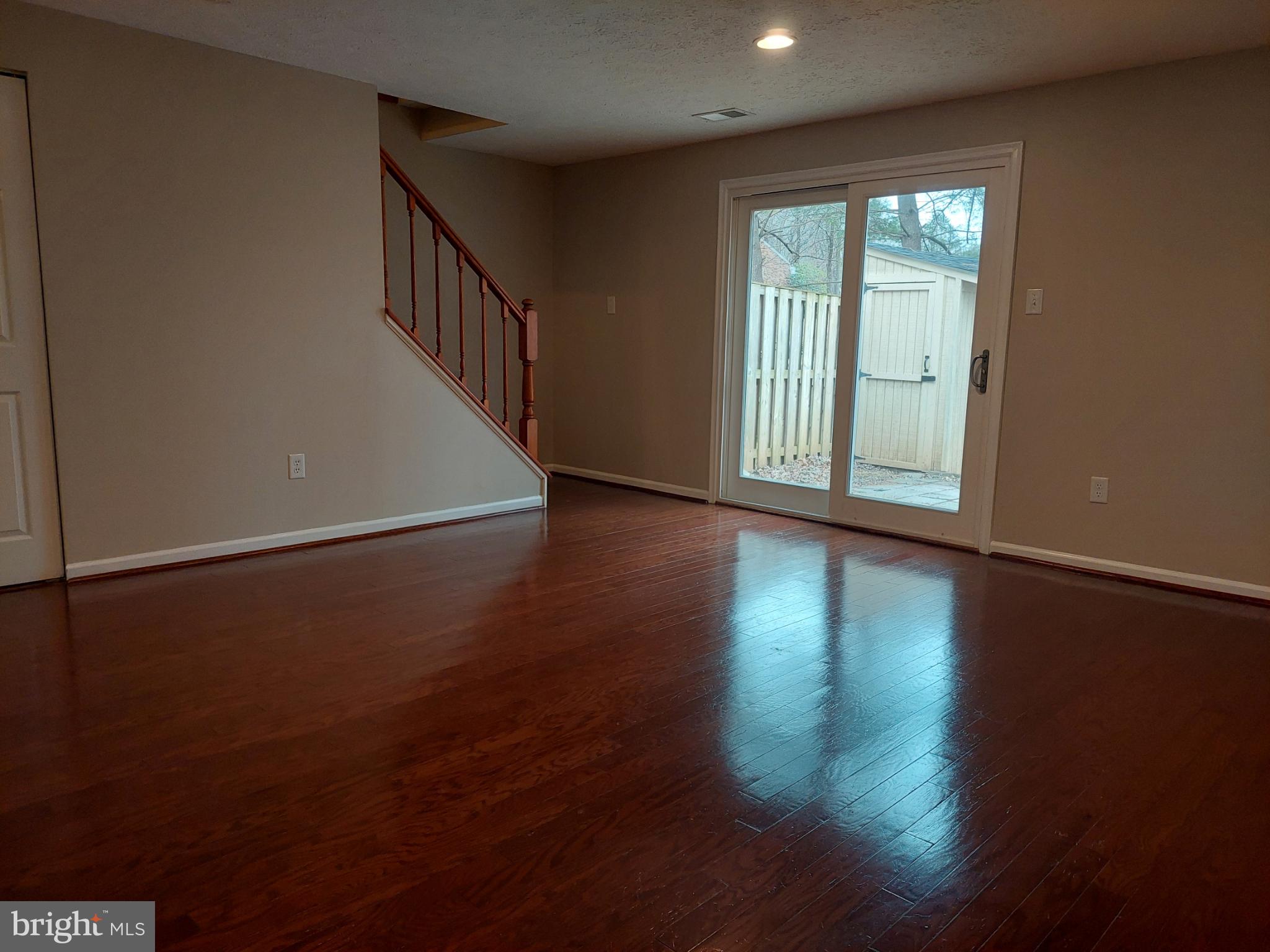 10149 Shelldrake Circle Damascus, MD 20872 - Photo 32 of 73 a view of an empty room with wooden floor and a window