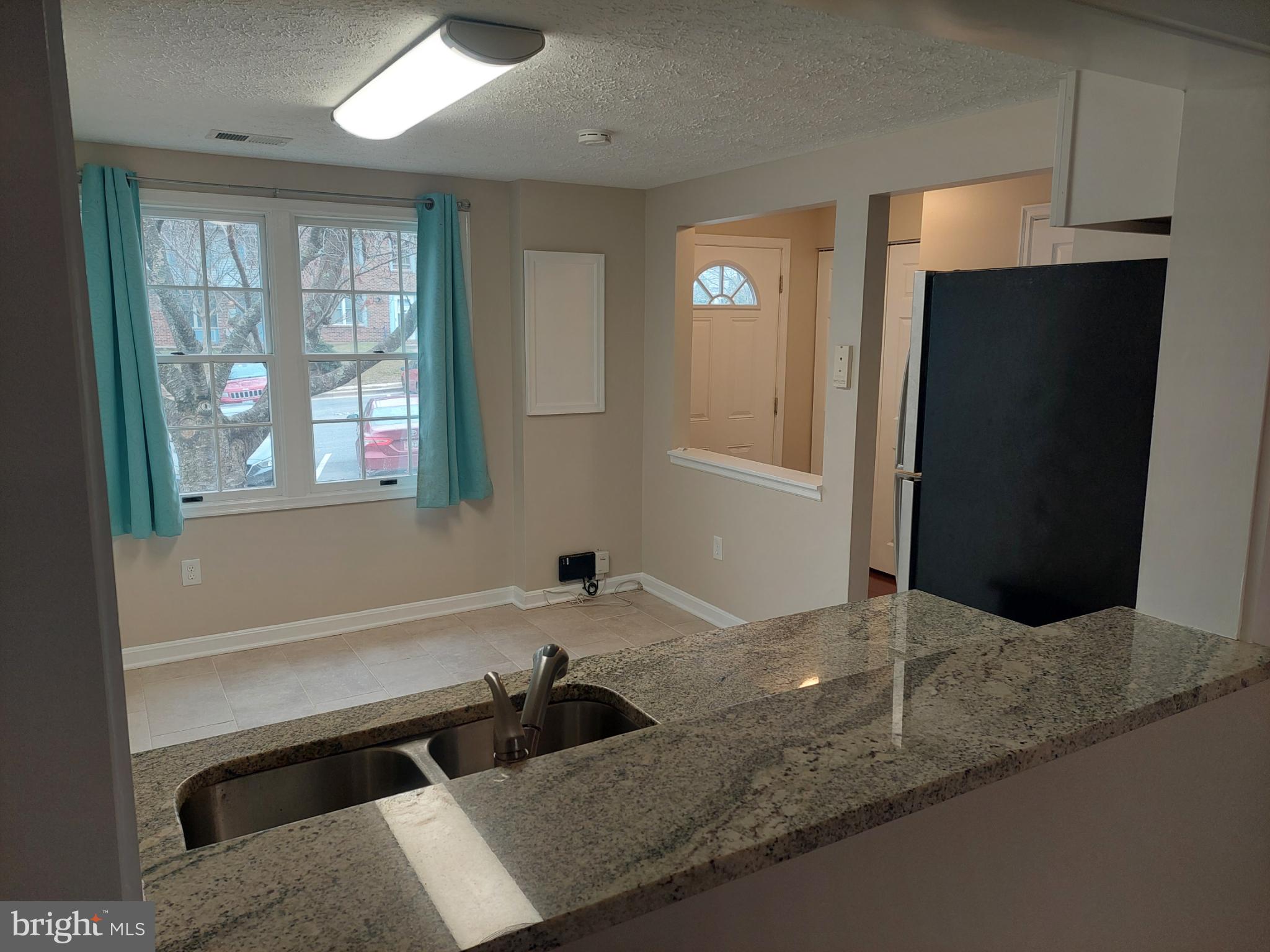 10149 Shelldrake Circle Damascus, MD 20872 - Photo 33 of 73 a bathroom with a granite countertop sink and a bathtub