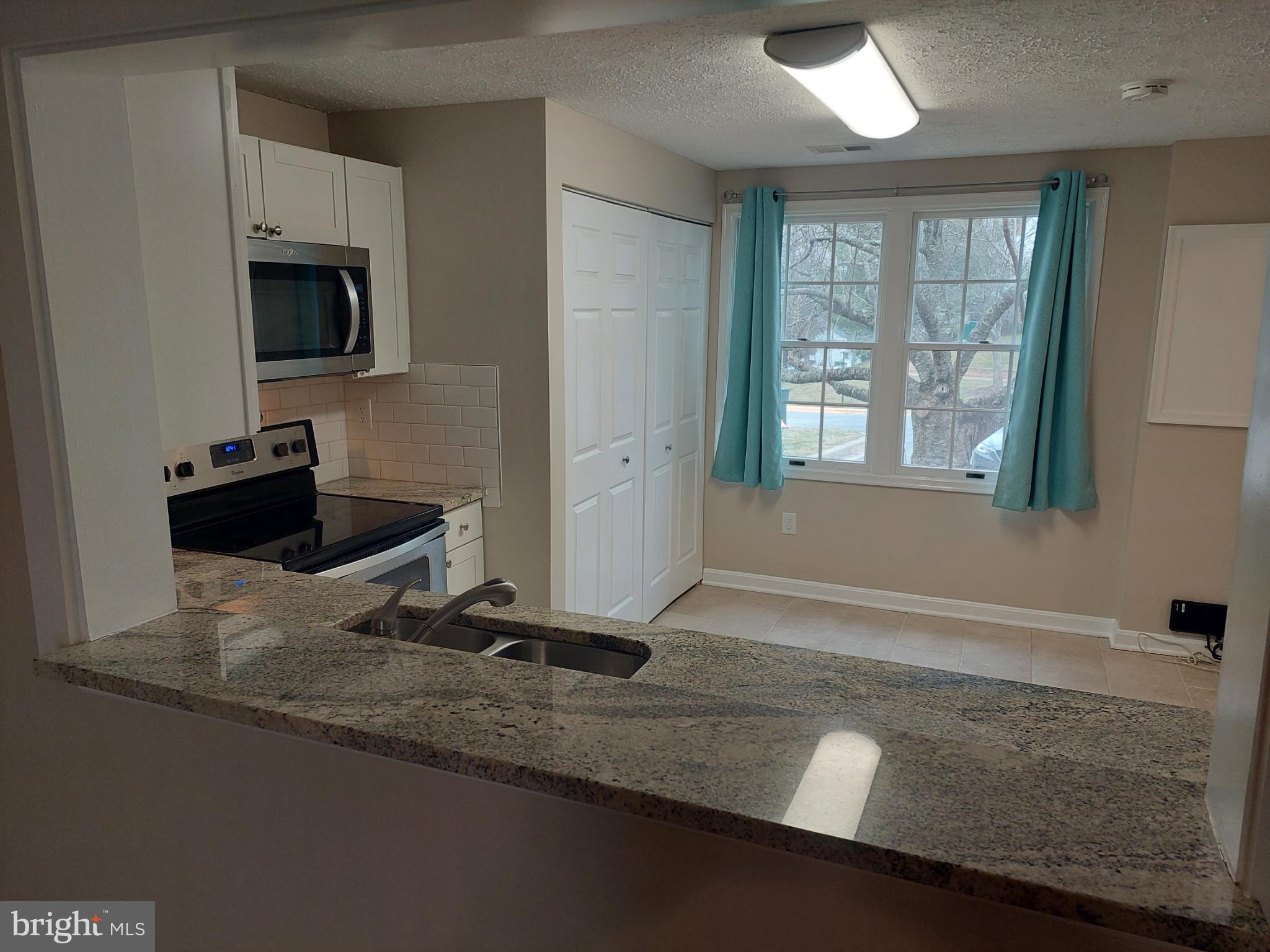 10149 Shelldrake Circle Damascus, MD 20872 - Photo 34 of 73 a room with a couch and a flat screen tv