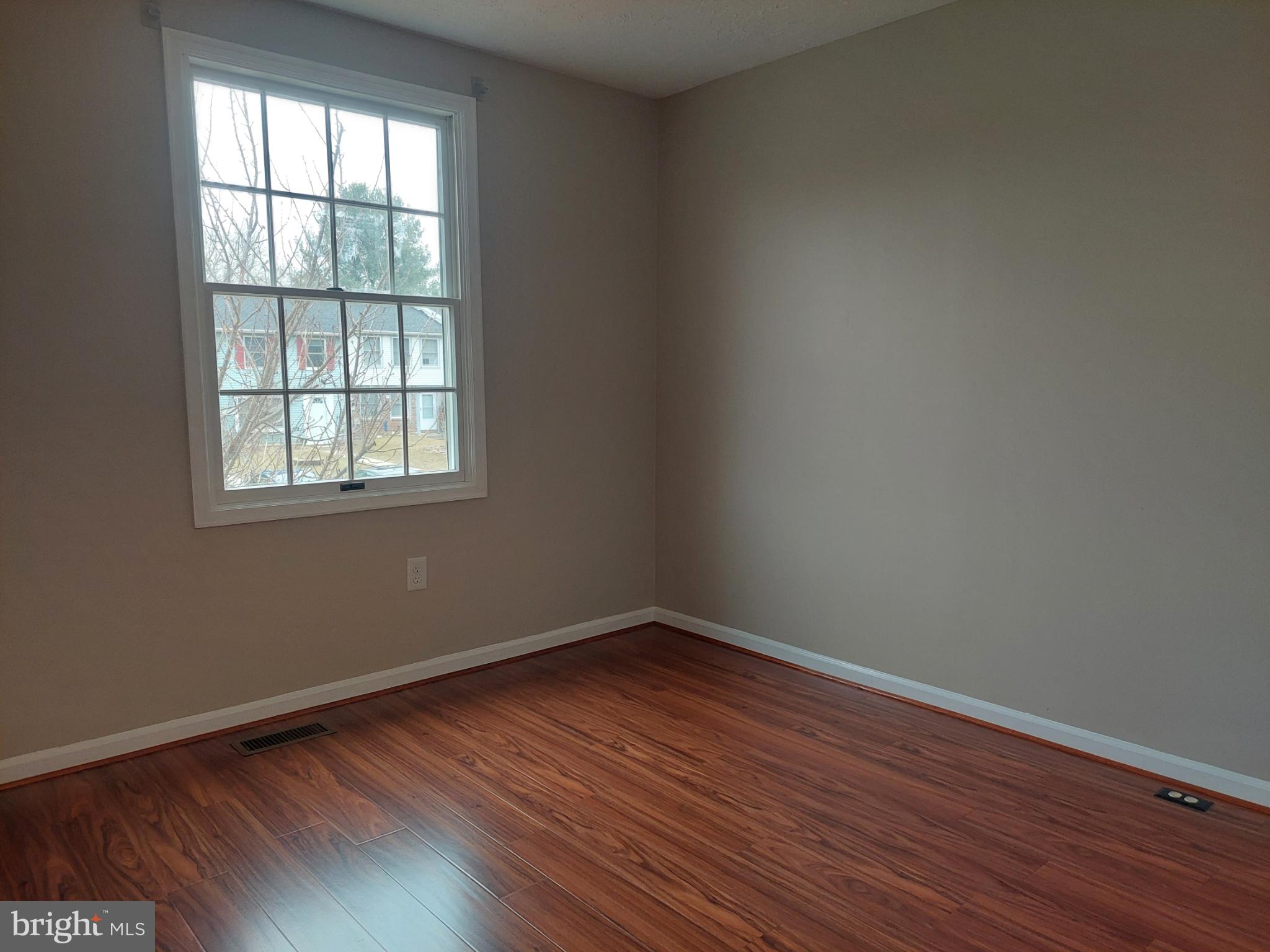 10149 Shelldrake Circle Damascus, MD 20872 - Photo 39 of 73 an empty room with wooden floor and windows