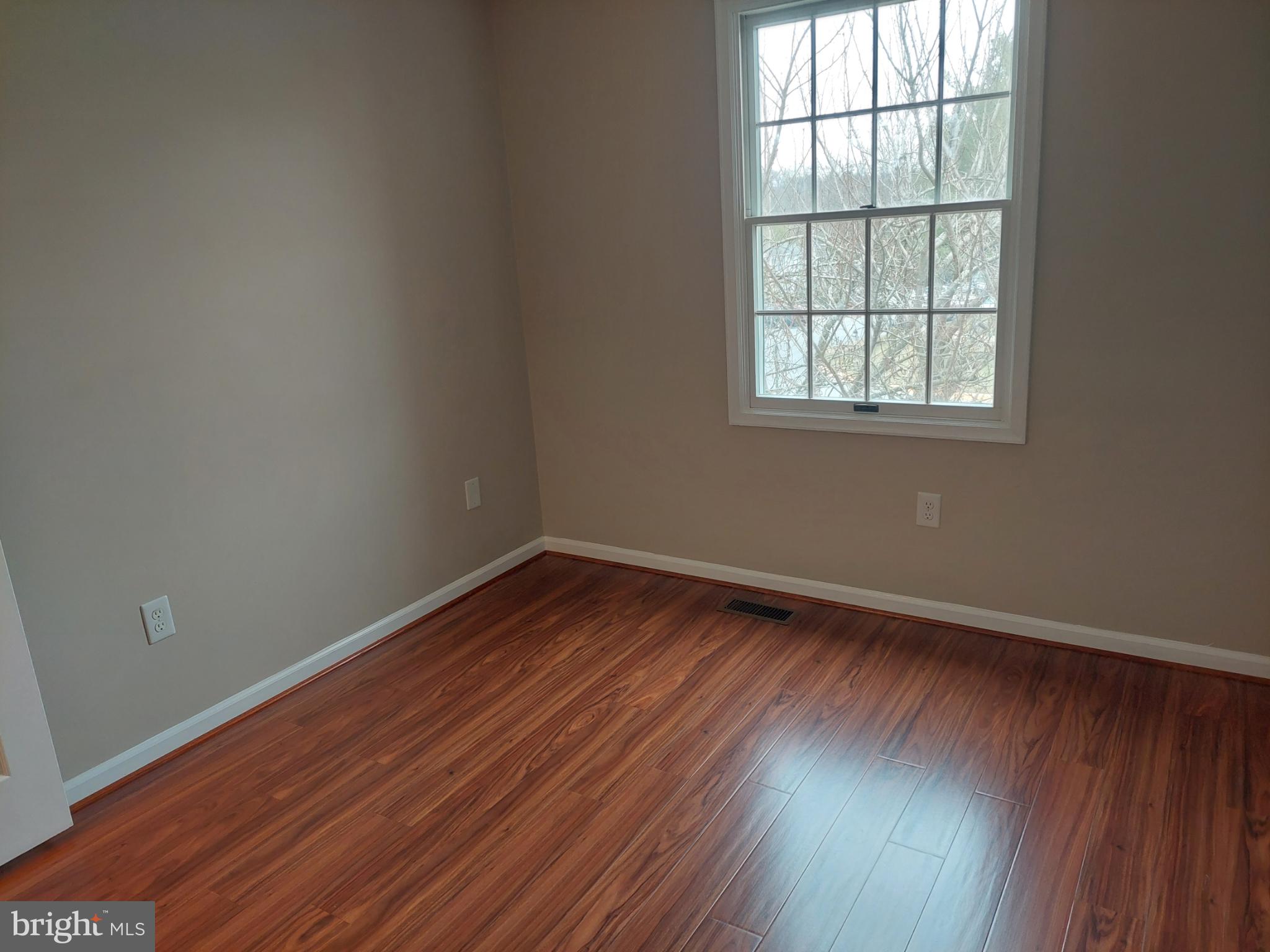 10149 Shelldrake Circle Damascus, MD 20872 - Photo 43 of 73 an empty room with wooden floor and windows
