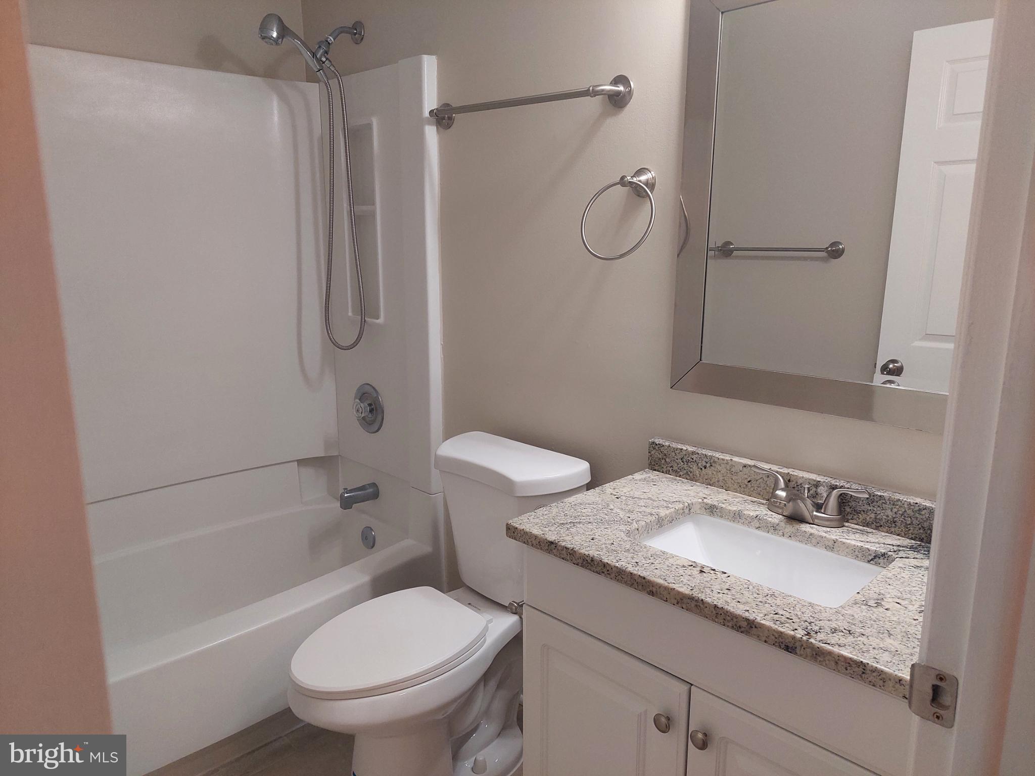 10149 Shelldrake Circle Damascus, MD 20872 - Photo 53 of 73 a bathroom with a granite countertop sink toilet and shower