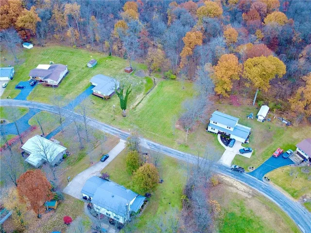 a bathroom with a sink mirror and flowers