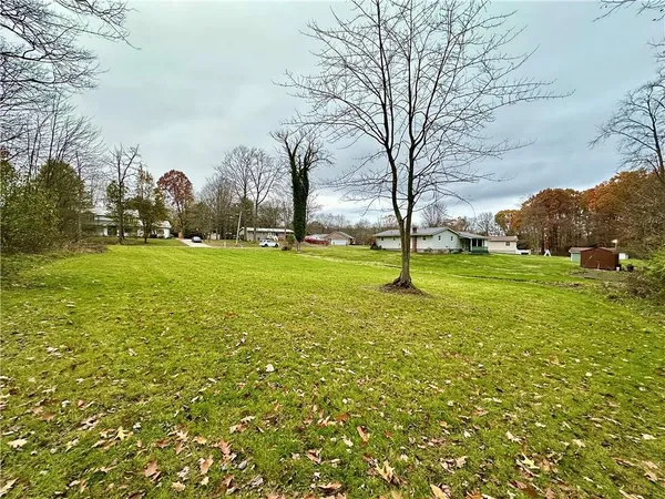 a backyard of apartments with large trees