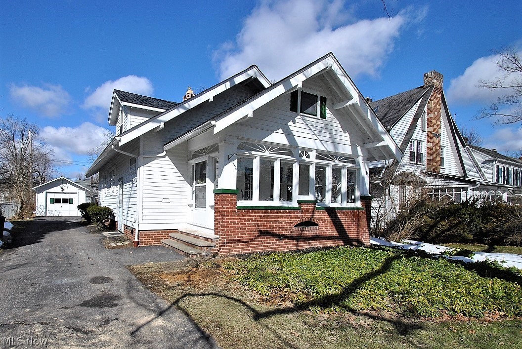 Gorgeous Cape Cod with full front sunporch.
