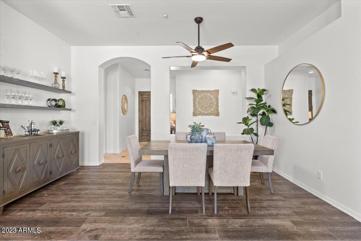 14257 North 106th Place Scottsdale, AZ 85255 - Photo 12 of 58 a view of a dining room with furniture and a chandelier