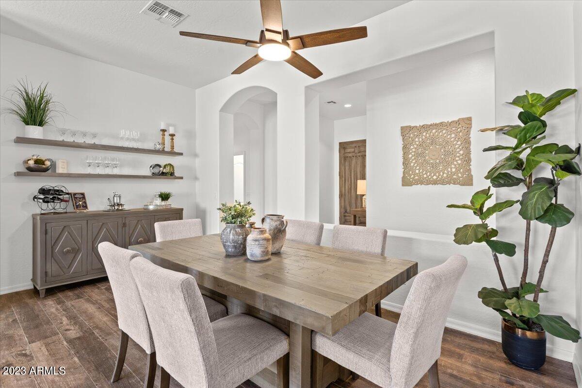 14257 North 106th Place Scottsdale, AZ 85255 - Photo 13 of 58 a view of a dining room with furniture and wooden floor