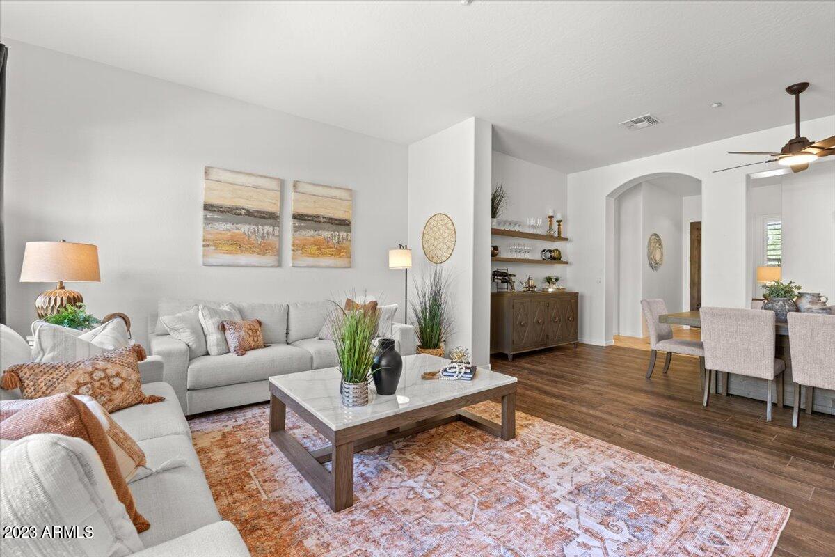 14257 North 106th Place Scottsdale, AZ 85255 - Photo 17 of 58 a living room with furniture and wooden floor