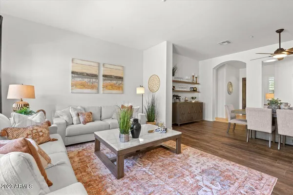a dining room with furniture and wooden floor