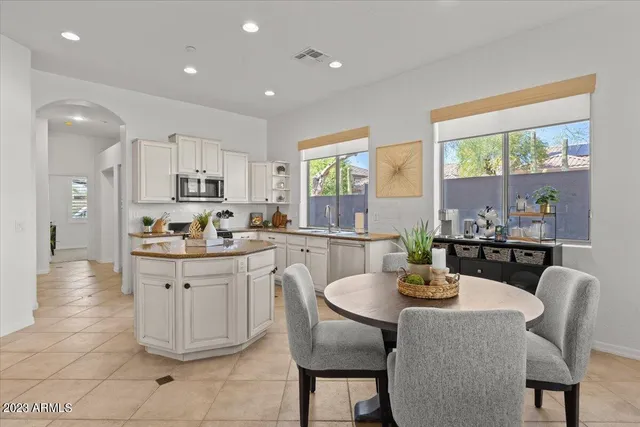 a dining room with furniture and wooden floor