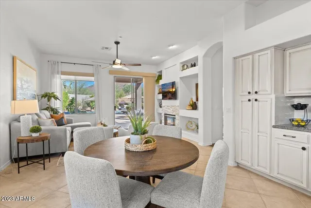 a kitchen with stainless steel appliances granite countertop a sink and a refrigerator