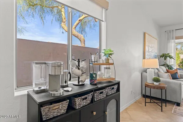 a living room with furniture and a large window