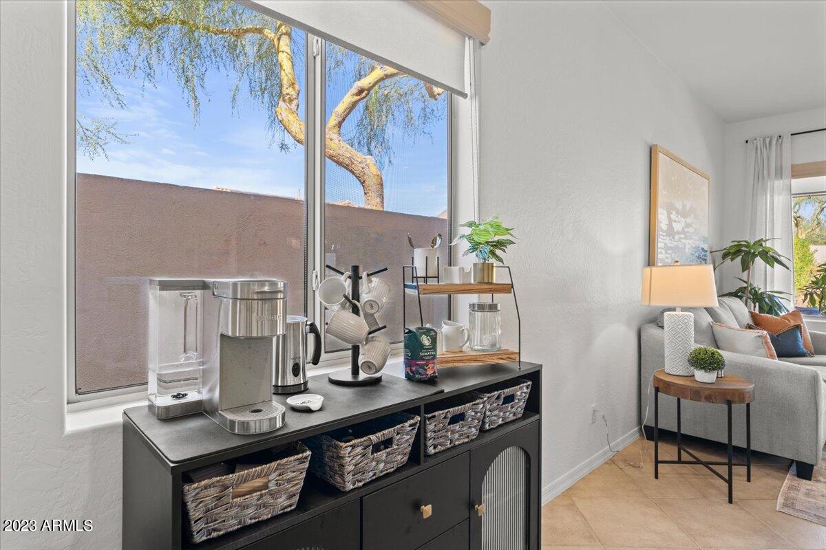 14257 North 106th Place Scottsdale, AZ 85255 - Photo 22 of 58 a dining room with furniture and wooden floor