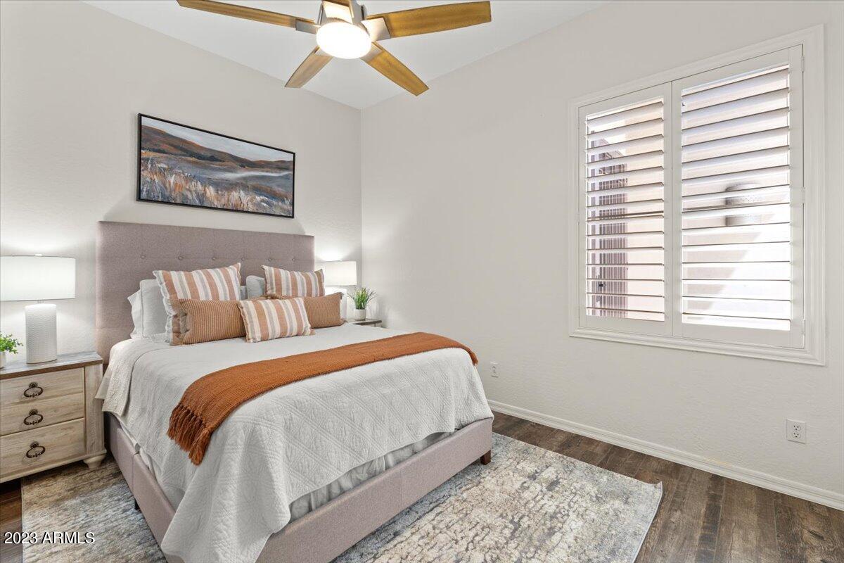 14257 North 106th Place Scottsdale, AZ 85255 - Photo 35 of 58 a bedroom with a bed and a window