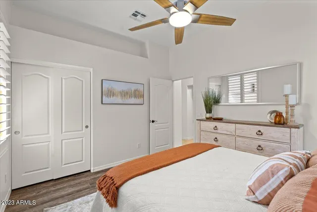 a bedroom with a bed and a dresser