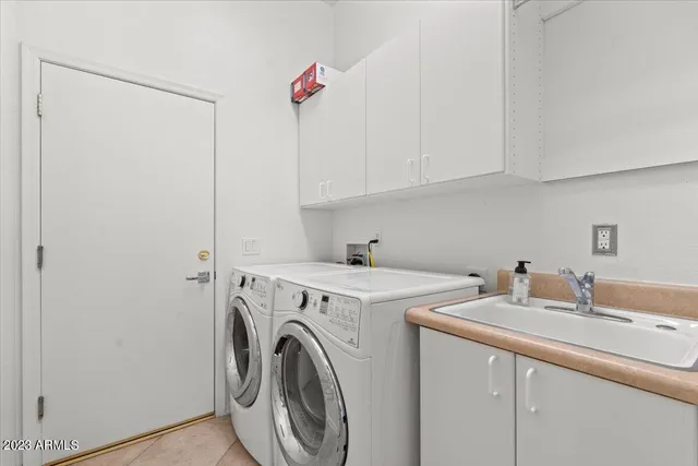 a living room with furniture fireplace and floor to ceiling window