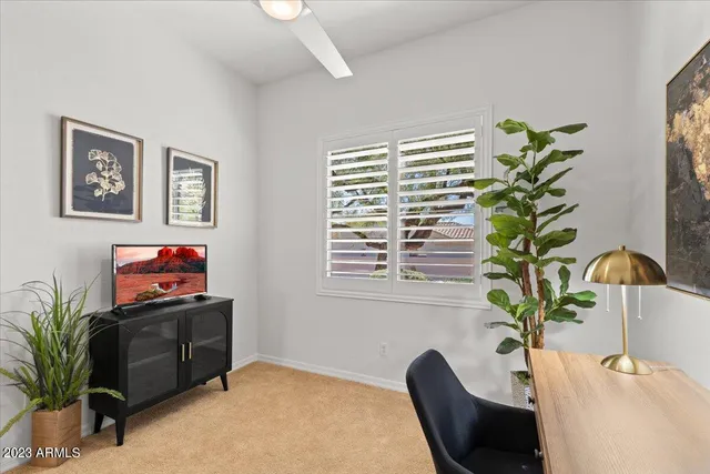 a view of an outdoor space with furniture and umbrella