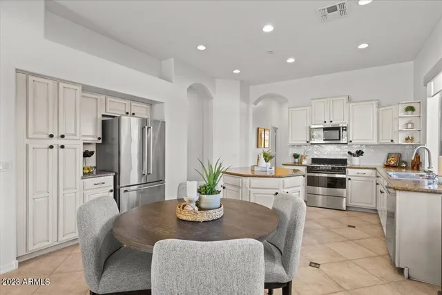 a view of a house with a mountain in the background