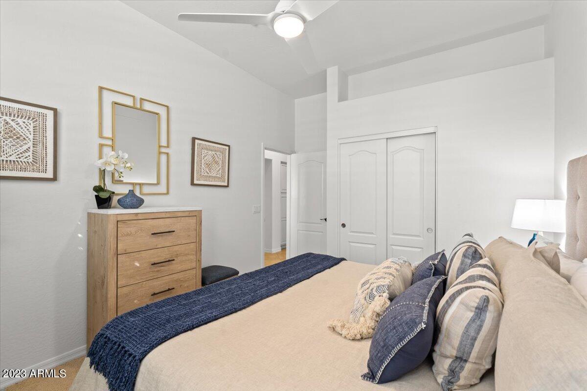 14257 North 106th Place Scottsdale, AZ 85255 - Photo 42 of 58 a bedroom with a bed and a dresser